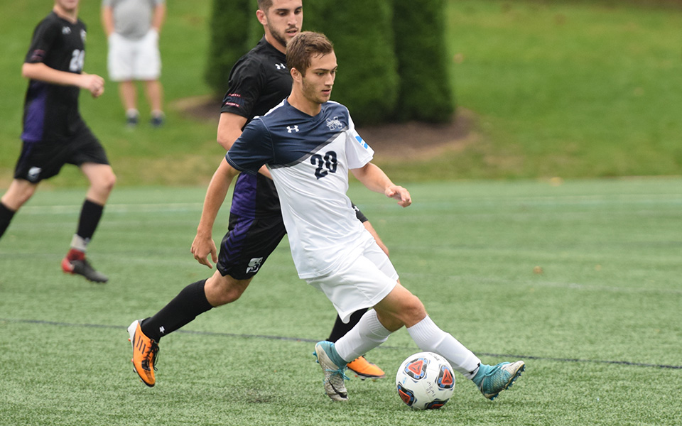 Anthony Nagy controls the ball in the midfield during a match versus The University of Scranton on John Makuvek Field in the fall of 2018.