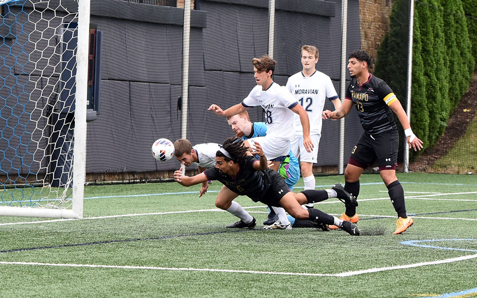 Donald Gibbs heads in a free kick for the first goal of his Moravian career versus Ramapo College of New Jersey on John Makuvek Field. Photo by Avery Saladino '24