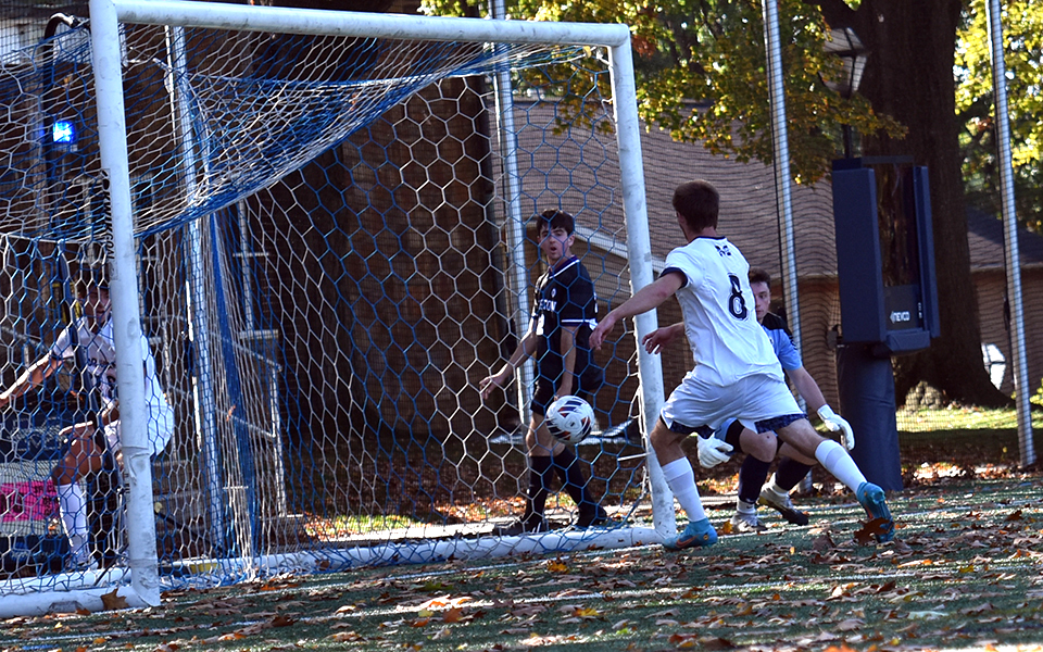 Senior midfielder Carson Snyder puts a shot into the net for the Greyhounds goal versus The University of Scranton on John Makuvek Field. Photo by Avery Saladino '24