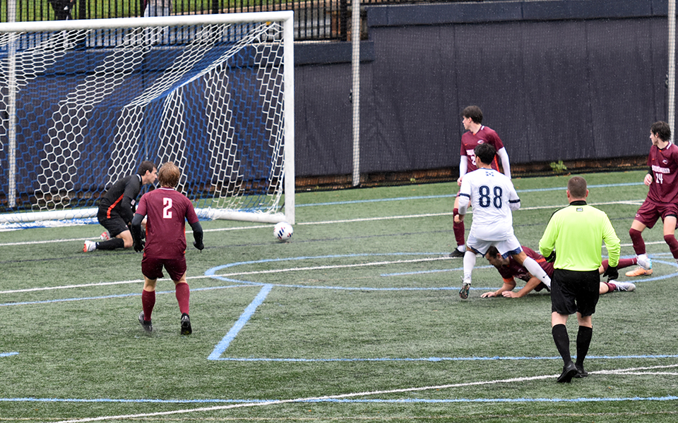 Junior Ben Scary puts a shot into the net in the second half versus Susquehanna University on John Makuvek Field. Photo by Jordyn Itterly '25