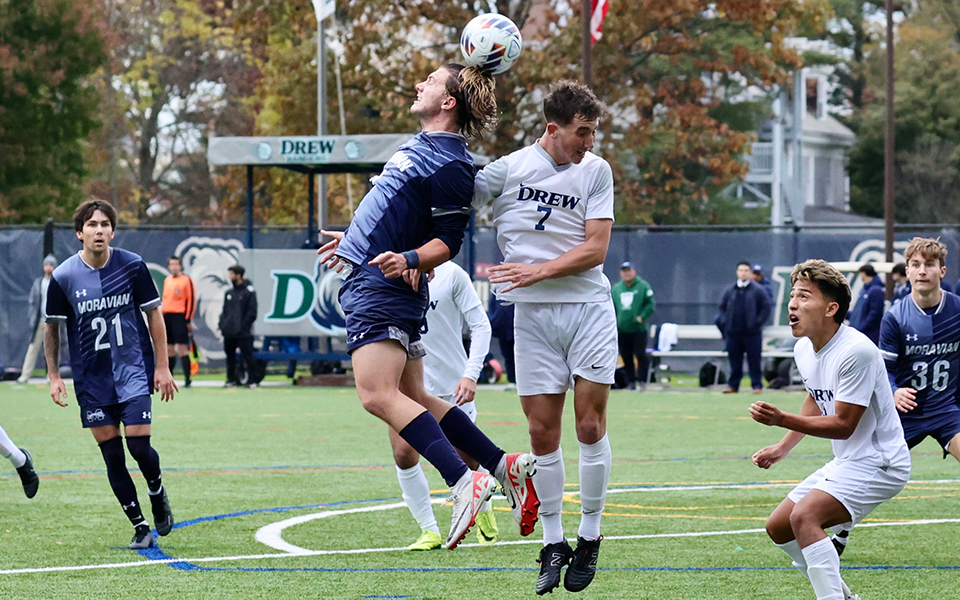 Senior midfielder Dave Steinbach heads a ball in the Landmark Conference Tournament First Round match at Drew University. Photo by Bob Koch/Entropy Sports Photography