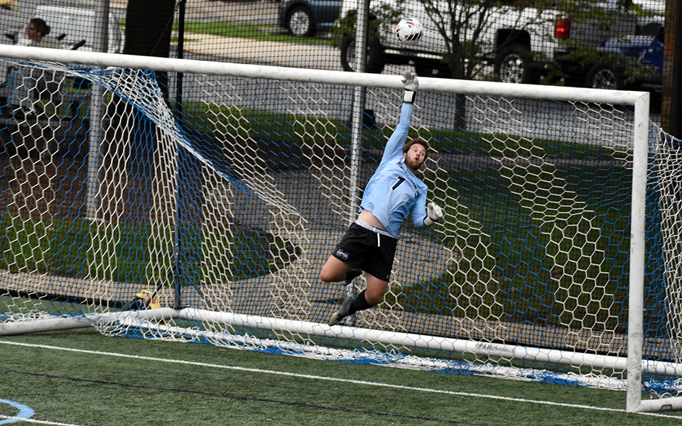 Senior goalie Christian Beebe lays out to tip a ball over the net late in the second half to keep the match scoreless with visiting Union(N.Y.) College on John Makuvek Field.