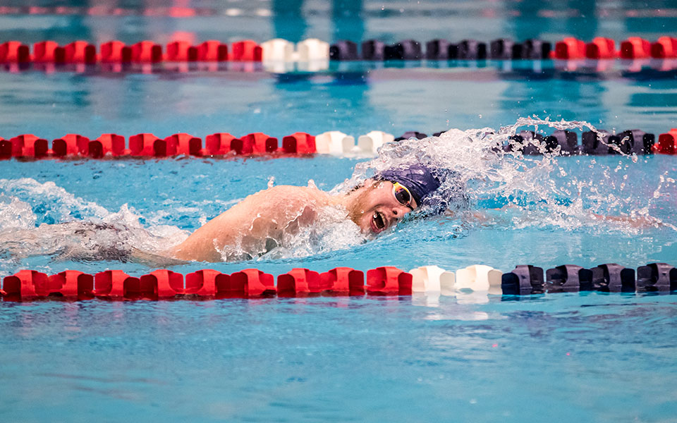 Harrison Ziegler swimming at the first home meet in program history at Liberty High School.