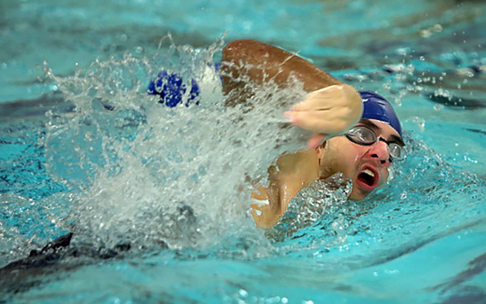 Freshman Billy Stergianopoulos competes in the opening session at the Cougar Splash Invitational. Photo by Timothy R. Dougherty / Double Eagle Photography
