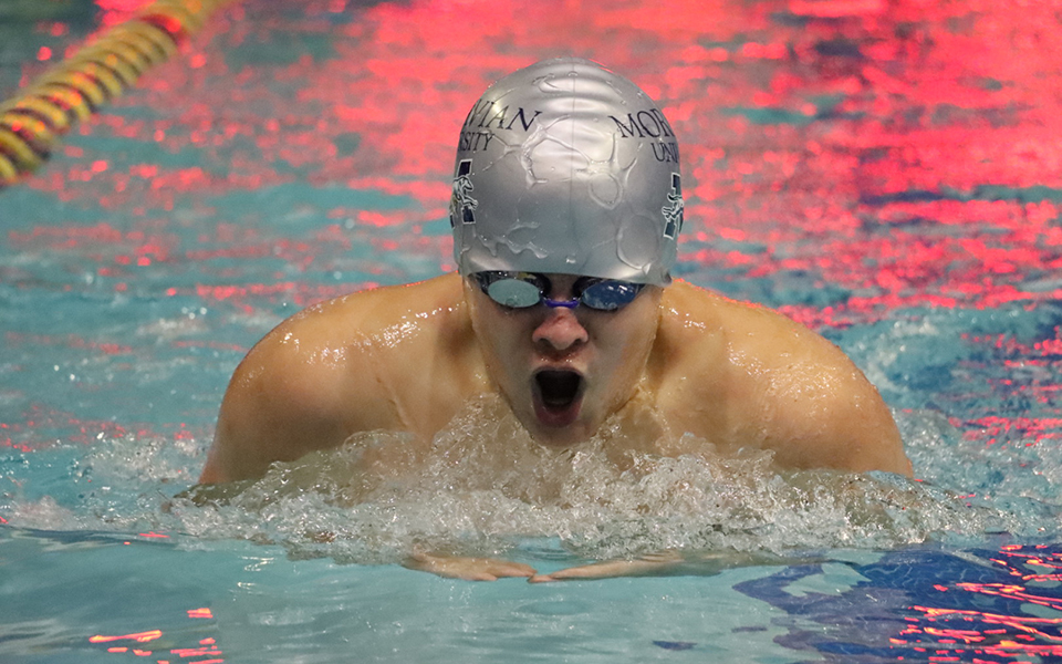 Freshman Jeffrey Eisenhardt swims in the 200-yard breaststroke at Misericordia University. Photo by Marissa Werner '23