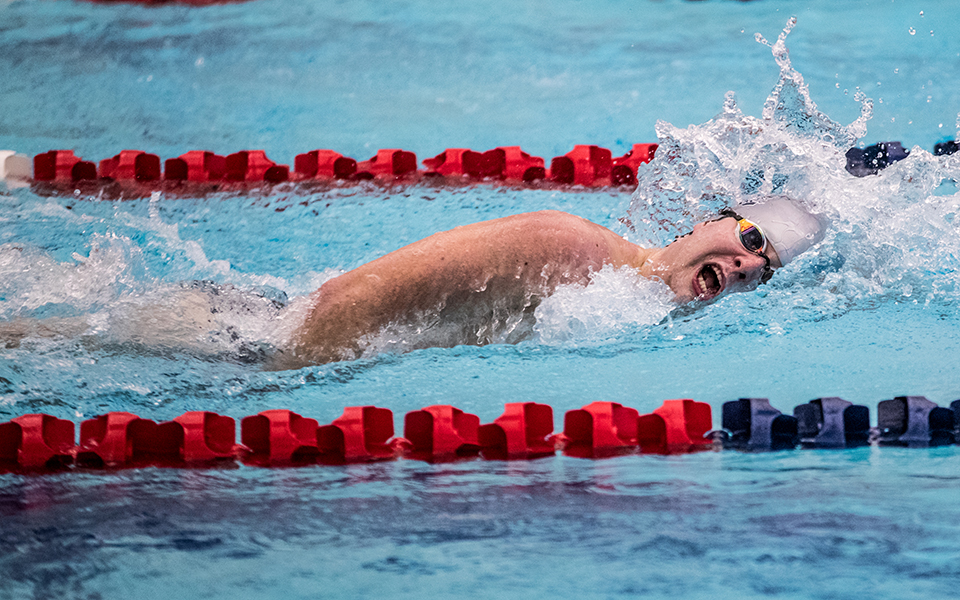 Sophomore Harrison Ziegler competes in a freestyle event in a double dual meet with Goucher College and Susquehanna University at Liberty High Schoo's Memorial Pool earlier this season. Photo by Cosmic Fox Media / Matthew Levine '11