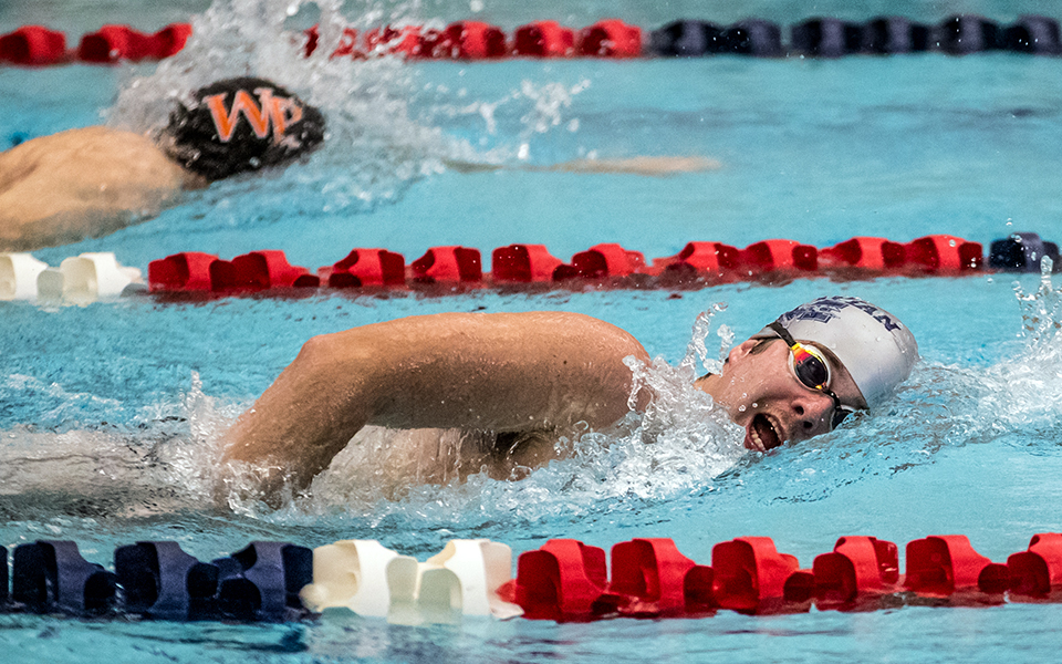 Junior Harrison Ziegler swims in a freestyle event versus William Paterson University at Liberty High School's Memorial Pool earlier this season. Photo by Cosmic Fox Media / Matthew Levine '11