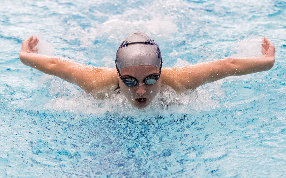 Freshman Daniel Leshnower swims the butterfly versus Immaculata University at Liberty High School's Memorial Pool to start the 2024-25 season. Photo by Cosmic Fox Media / Matthew Levine '11