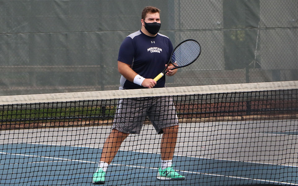 Kieran Pisani waits at the net during doubles action in the Greyhounds' Blue & Grey scrimmage in October 2020.