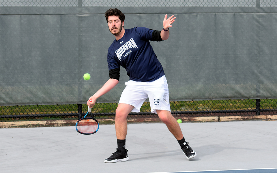 Junior Justin Szaro hits a forehand in his match versus Lycoming College at Hoffman Courts.
