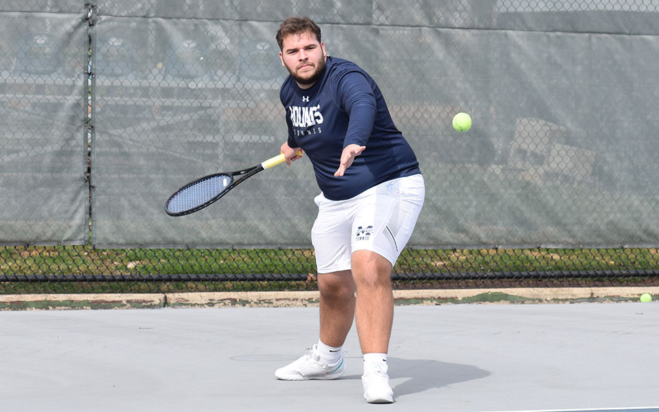 Junior Kieran Pisani returns a shot versus Lycoming College at Hoffman Courts in March 2022.