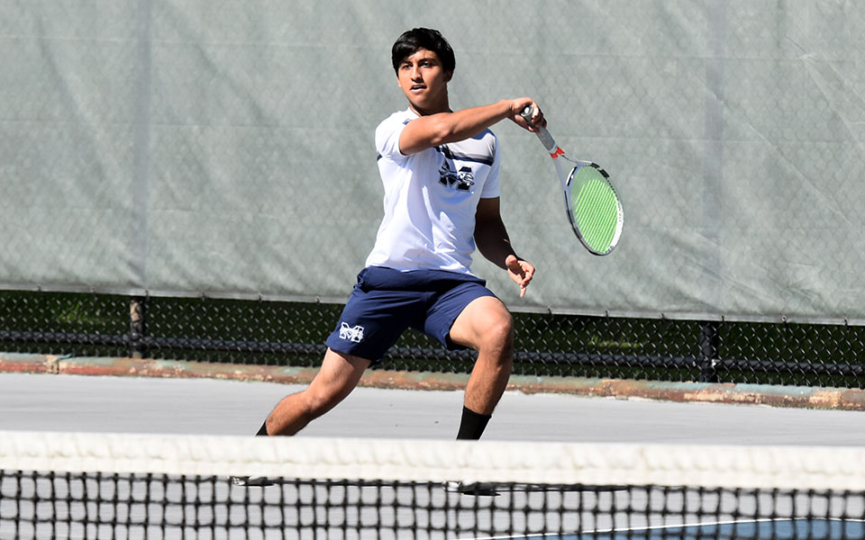 Freshman Shayaan Farhad returns a shot during singles action versus Immaculata University at Hoffman Courts. Photo by Mairi West '23