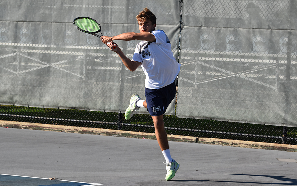 Sophomore Wyatt Marshall returns a shot during doubles action versus FDU-Florham at Hoffman Courts.