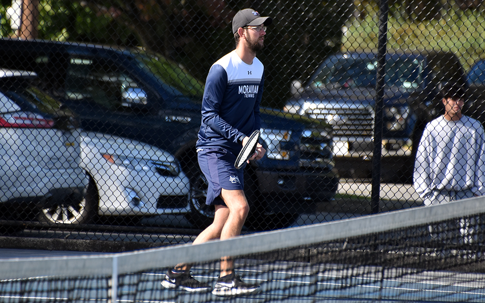 Senior Aidan Evans-Gartley gets set to return a shot in doubles action during a match with Rutgers-Camden at Hoffman Courts during the 2022 fall season.