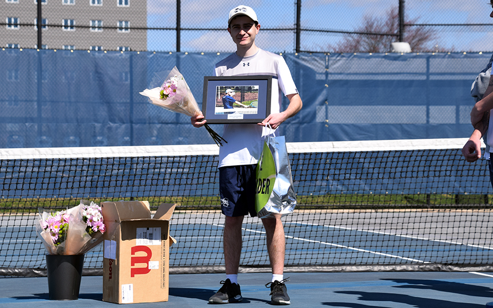 Senior Steve Schneider being honored prior to the match with Penn State Abington at Hoffman Courts on Senior Day.