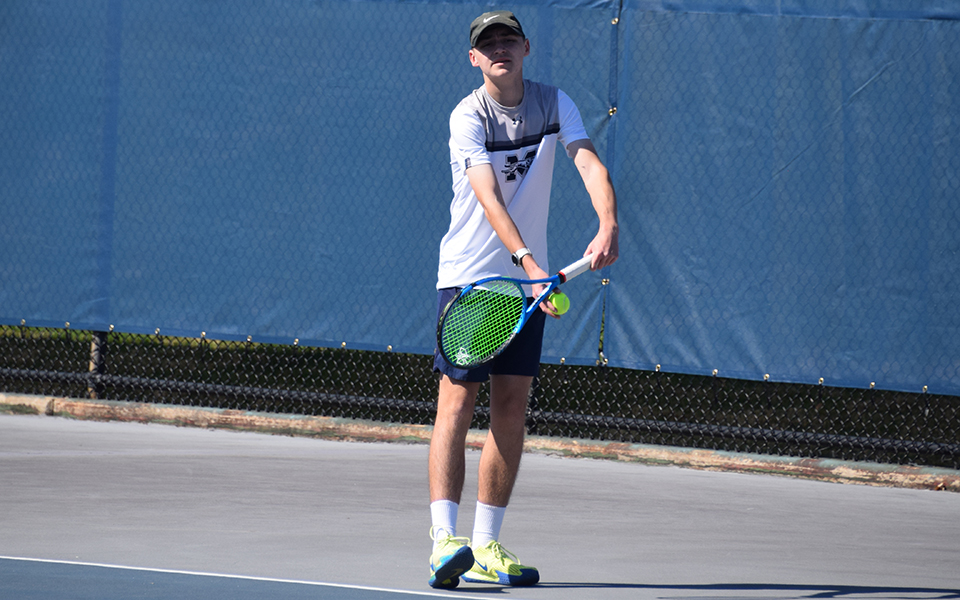 Freshman Gavin Labbadia gets set to serve in a match versus Penn State Abington at Hoffman Courts earlier this season.