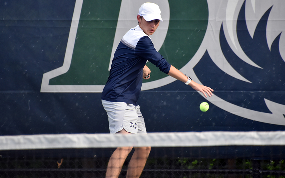 Freshman Gavin Labbadia returns a shot in the 2024 Landmark Conference Semifinal at Drew University. Photo by Christine Fox