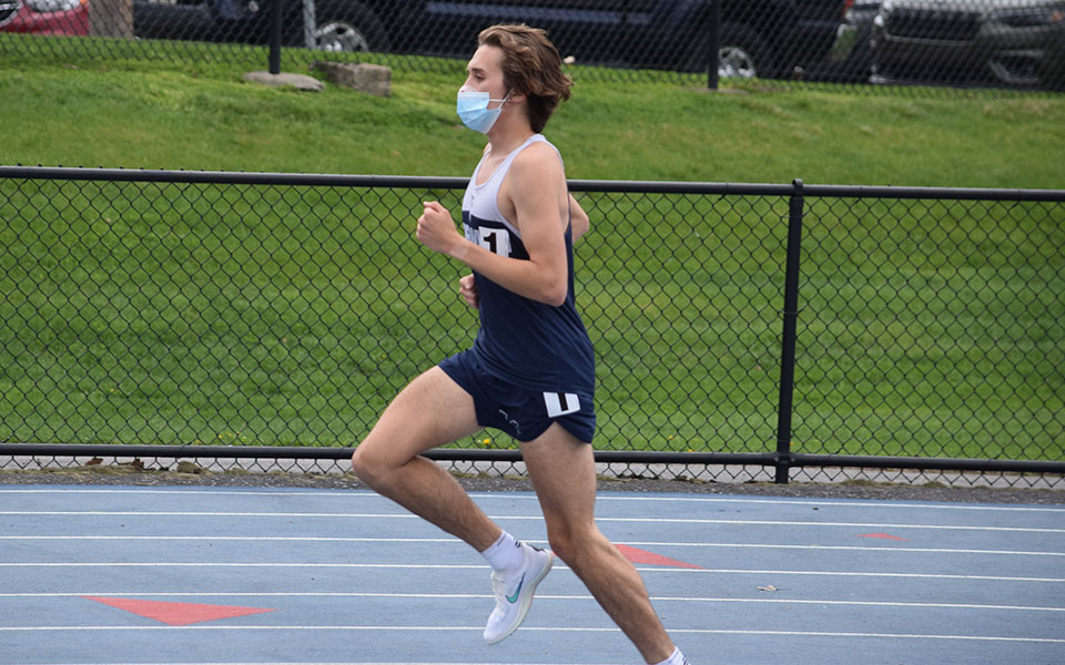 Shane Houghton '22 runs in the 5,000-meter race during the Coach P Invitational at Timothy Breidegam Track on April 17, 2021.
