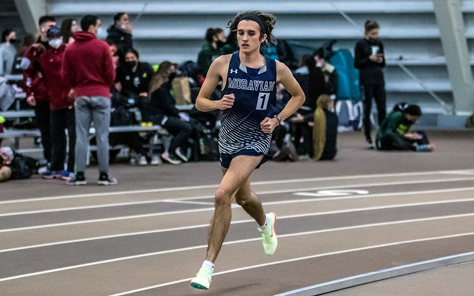 Senior Shane Houghton races in the 5,000-meter run in the Moravian Indoor Meet at Lehigh University's Rauch Fieldhouse. Photo by Cosmic Fox Media / Matthew Levine '11
