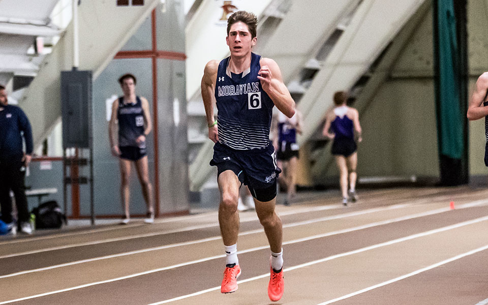 Senior Dominic DeRafelo races during the 2022 Moravian Indoor Meet at Lehigh University's Rauch Fieldhouse in January. Photo by Cosmic Fox Media / Matthew Levine '11