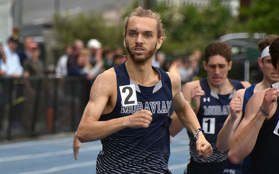 Graduate student Peter Gingrich runs a PR in the 800-meter run in his final career individual race at the 2022 All-Atlantic Region Championships at Timothy Breidegam Track. Senior Dominic DeRafelo in the background also ran a PR in his final career race. Photo by Christian Jancsarics '23