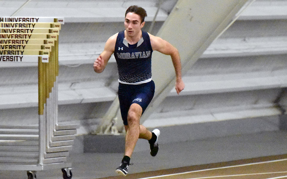 Sophomore Marco Calantoni runs on the finals of the 60-meter dash at the Lehigh University Fast Times Before Finals in Rauch Fieldhouse.