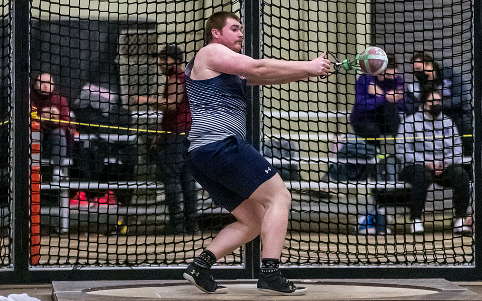 Junior Dan Jenkins competes in the 35-pound weight throw during the Moravian Indoor Meet at Lehigh University's Rauch Fieldhouse. Photo by Cosmic Fox Media / Matthew Levine '11