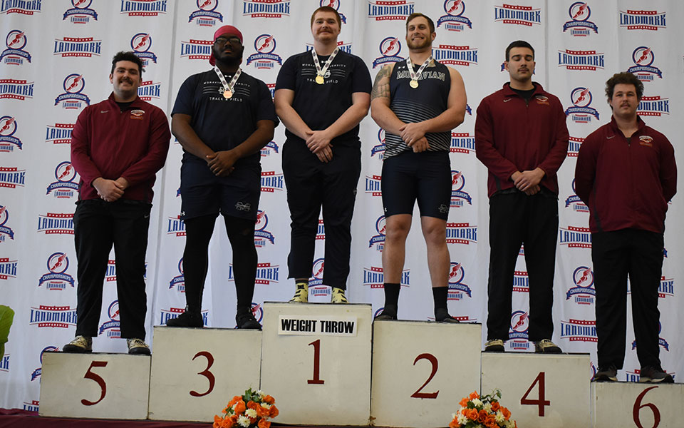 The men's 35-pound weight throw podium from the 2022 Landmark Conference Indoor Championships with Moravian's Dan Jenkins in first, Shane Mastro in second and Tim King in third. Photo courtesy of Susquehanna University Athletic Communications