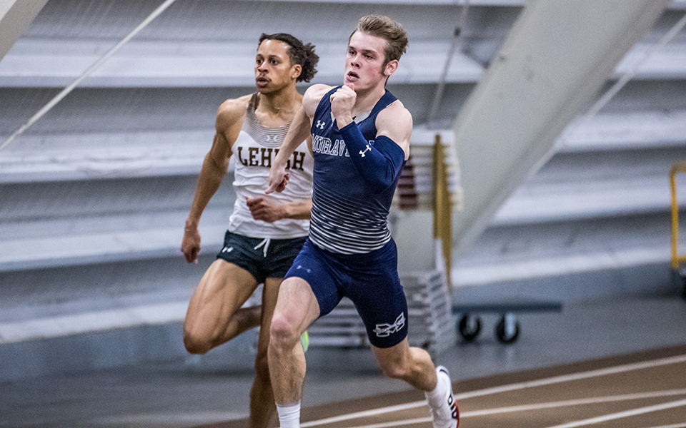 Sophomore Trevor Gray comes to the finish line in first place in the 200-meter dash at the Moravian Indoor Meet held at Lehigh University's Rauch Fieldhouse. Photo by Cosmic Fox Media / Matthew Levine '11