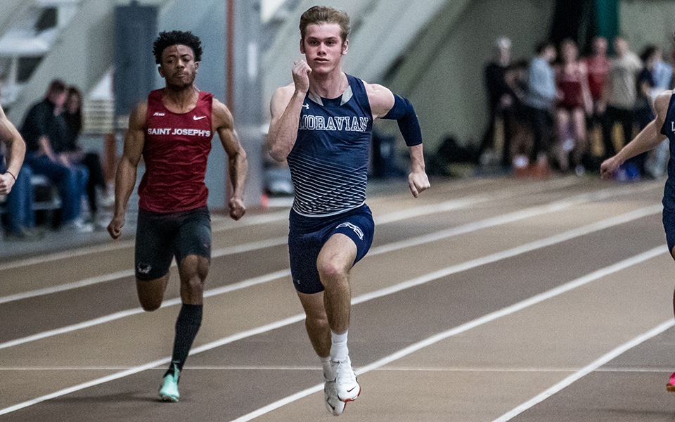 Sophomore Trevor Gray comes into the finish line during a sprint race in the Moravian Indoor Meet earlier this season at Lehigh University's Rauch Fieldhouse. Photo by Cosmic Fox Media / Matthew Levine '11