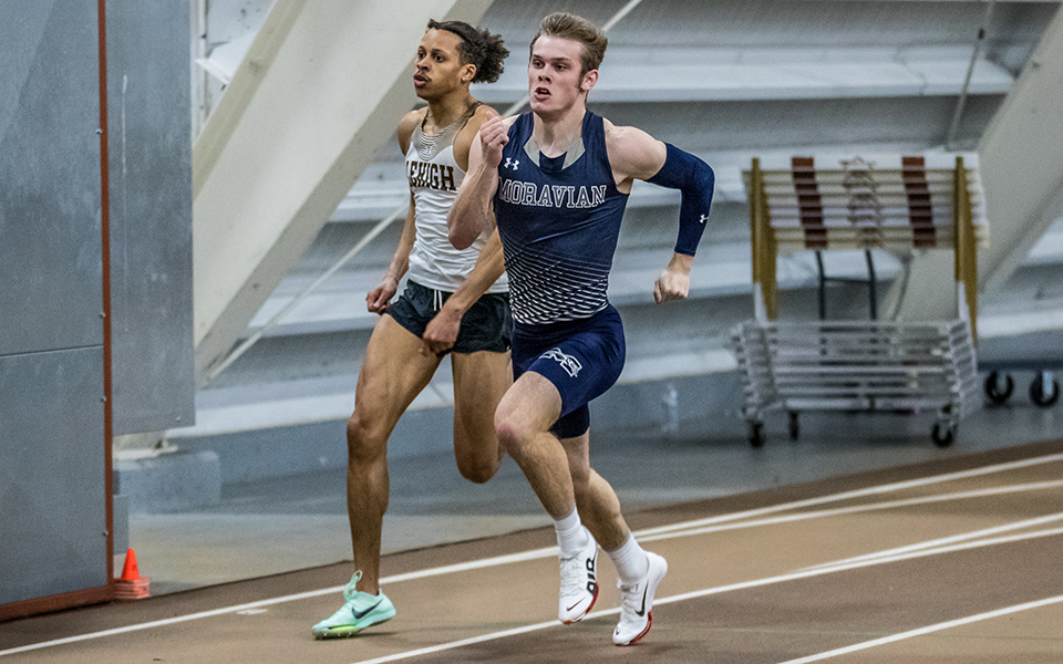 Sophomore Trevor Gray runs in the home straightaway in the 200-meter dash during the Moravian Indoor Meet at Lehigh University's Rauch Fieldhouse. Photo by Cosmic Fox Media / Matthew Levine '11