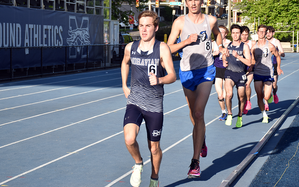 Sophomore Nathan Hajel leads the pack on his way to winning the 10,000-meter run in the 2023 Landmark Conference Championships at Timothy Breidegam Track. Photo by Christine Fox