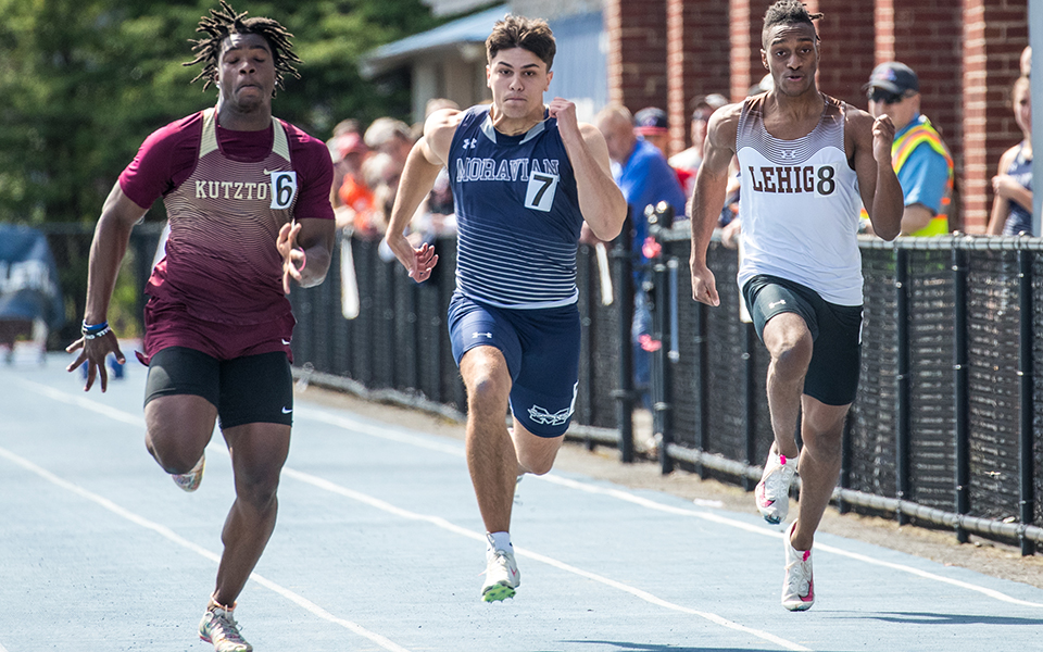 Sophomore Jared Fenstermaker runs in the final of the 100-meter dash during the 2024 Coach Pollard Invitational at Timothy Breidegam Track. Photo by Cosmic Fox Media / Matthew Levine '11