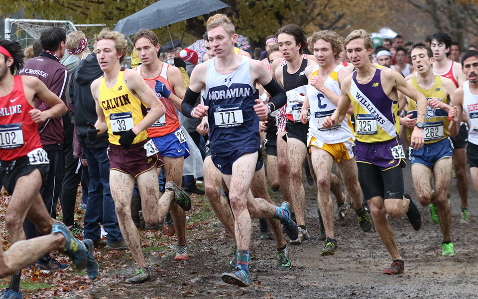 Senior Greg Jaindl runs on a muddy course at E.P. "Tom" Sawyer Park in Louisville, Kentucky during the 2019 NCAA Division III Cross Country National Championship. Photo by d3photography.com