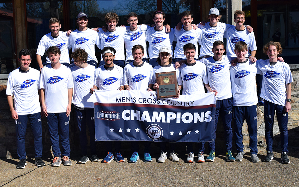 The men's cross country team with the 2022 Landmark Conference Championship trophy after winning their second straight title at Goucher College. Photo courtesy of Goucher College Athletic Communications