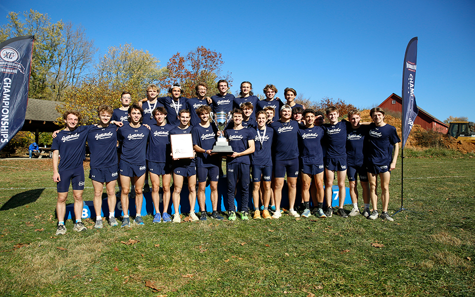 The Greyhounds with the 2024 Landmark Conference Men's Cross Country Championship trophy. Photo courtesy of Wyatt Eaton, Elizabethtown College Athletic Communications