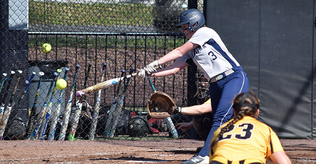 Lauren Goetz '20 connects with a pitch versus Ursinus College at Blue & Grey Field.