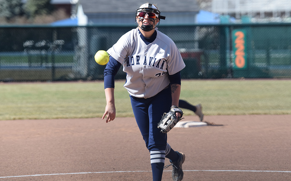 Junior Paige Lesher tossed a pitch towards the plate versus Drew University at Blue & Grey Field.