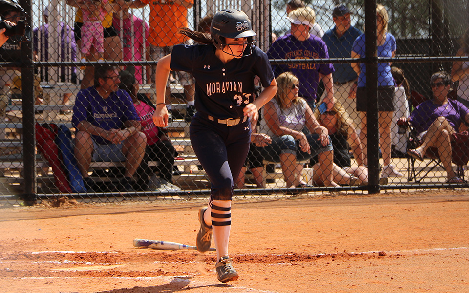 Senior Madison Shaneberger heads down the first base line on her 100th career hit versus Defiance College at the Spring Games in Florida.