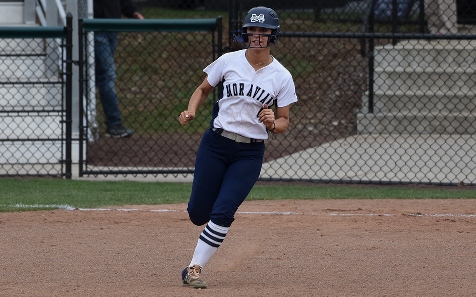 Senior Kat Spilman rounds first base after becoming the fourth Greyhound in school history to reach 200 career hits with an RBI single to end game two versus The Catholic University of America at Blue & Grey Field.