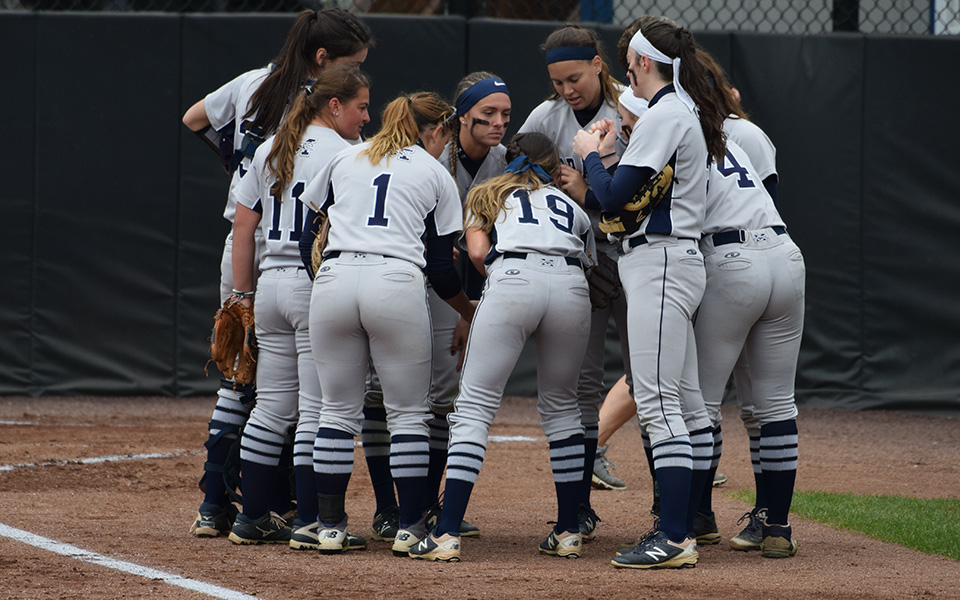 The Greyhounds huddle after the first inning of a game versus The University of Scranton in the 2019 Landmark Conference Tournament at Blue & Grey Field.