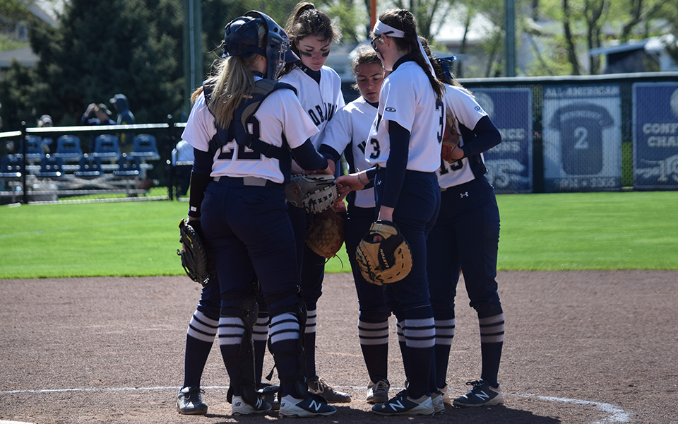 The Greyhounds huddle in the circle during a game versus Juniata College at Blue & Grey Field during the 2019 season.