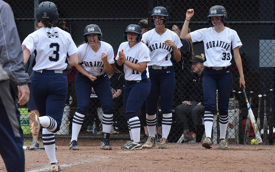 The Greyhounds greet senior Lauren Goetz at home plate after a home run during the 2019 Landmark Conference Tournament at Blue & Grey Field.