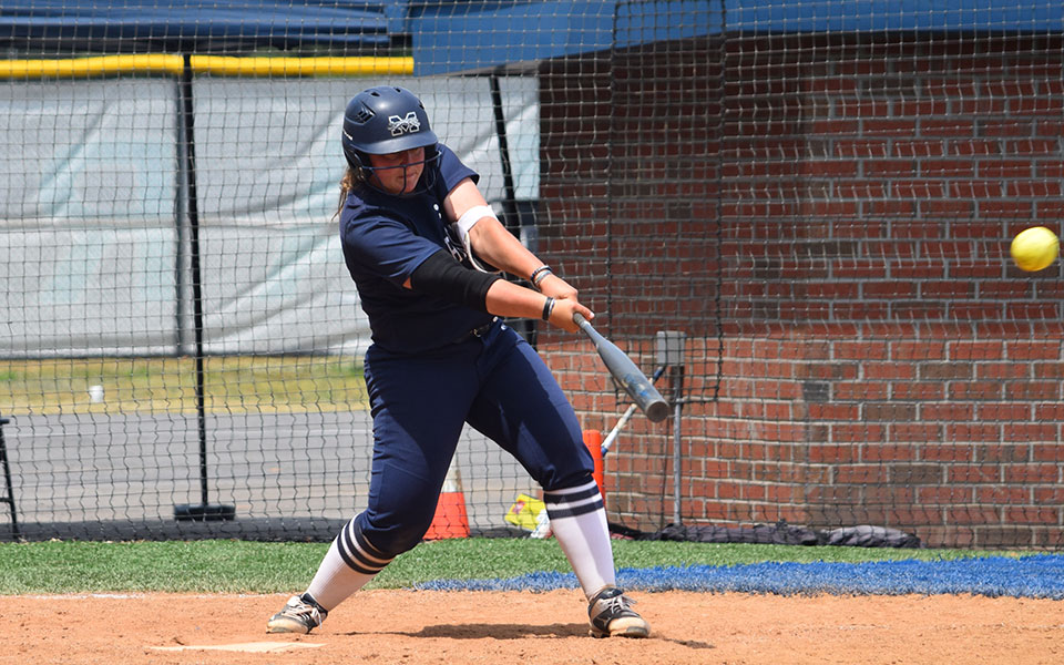 Maddisen Bieber '21 connects with a pitch versus The College of New Jersey in the NCAA Division III Virginia Beach Regional.