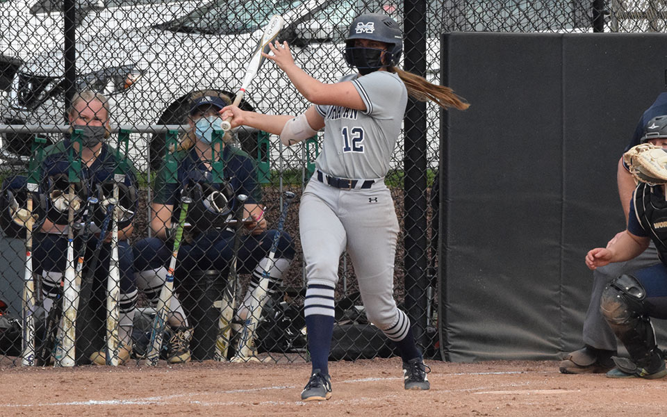 Alexandria Scheeler '22 follows through on a swing during the second game versus Drew University at Blue & Grey Field on April 28, 2021.