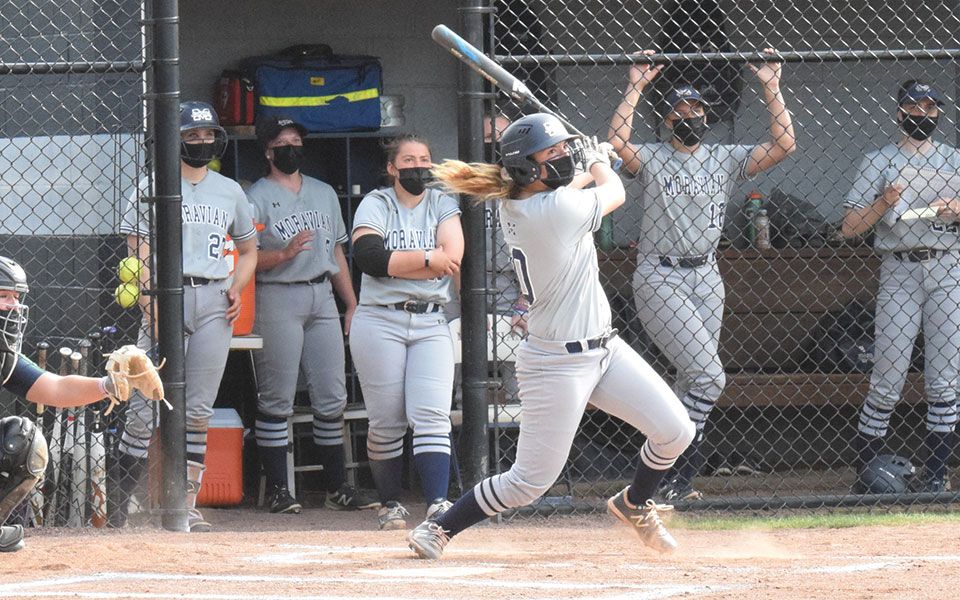 Alexis Agrapides '23 follows through after hitting a pitch during a game versus Drew University at Blue & Grey Field on April 28, 2021.