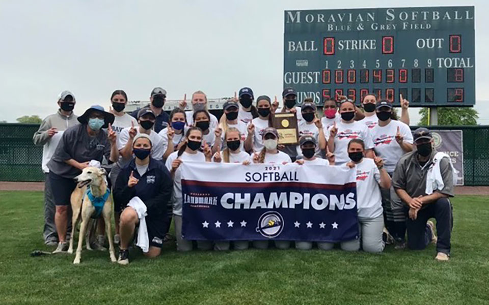 The Greyhounds celebrate their ninth Landmark Conference Championship at Blue & Grey Field on May 16, 2021.