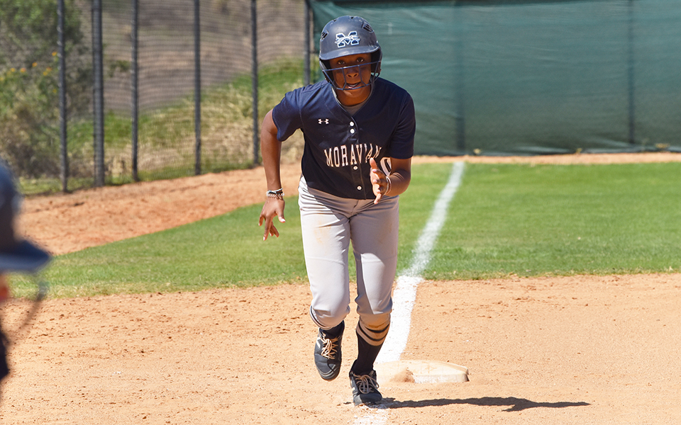Sophomore Ajala Elmore running towards home plate versus Mount Union at Legends Way in Clermont, Florida.