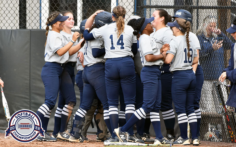 The Greyhounds celebrate Brooke Wehr's school-record 36th career home run versus DeSales University at Blue & Grey Field on May 2.