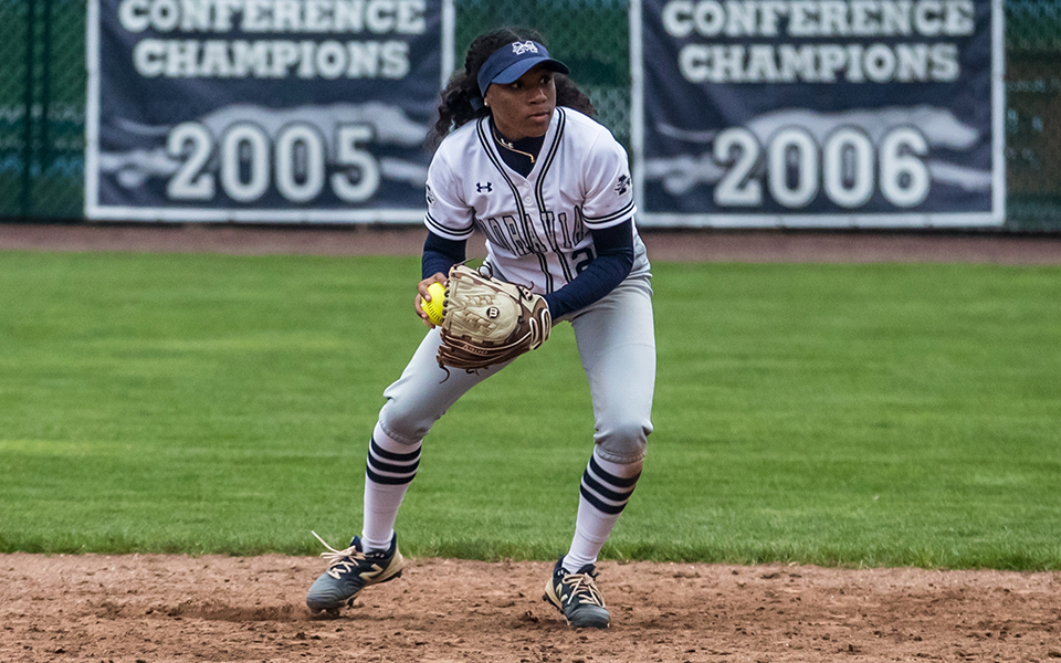 Junior second baseman Ajala Elmore gets ready to throw to first base during a game with rival Muhlenberg College at Blue & Grey Field during the 2022 season. Photo by Cosmic Fox Media / Matthew Levine '11